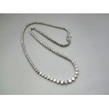 A Modern Diamond Set Necklace, of graduated design, claw set throughout with graduated brilliant cut