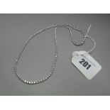 A Modern Diamond Set Line Necklace, claw set to the front with uniform (2mm) brilliant cut stones,