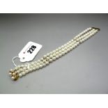 A Modern Three Row Pearl Bead Bracelet, of uniform design, to peal set bar clasp, with single cut