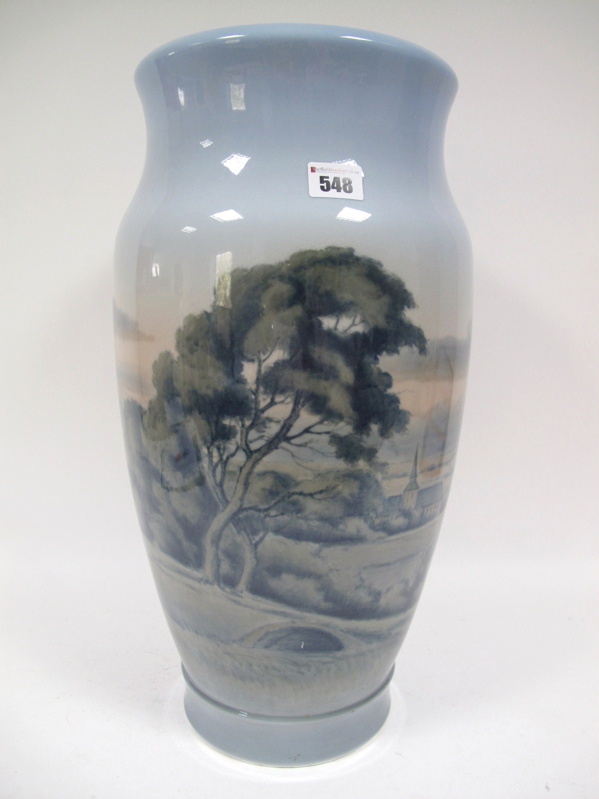 A Royal Copenhagen Floor Vase, by N.M. Plum, of inverted baluster form, decorated with a rural scene