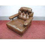 A Gentleman's Brown Leather Armchair, upholstered back and arms, with turned and reeded supports and