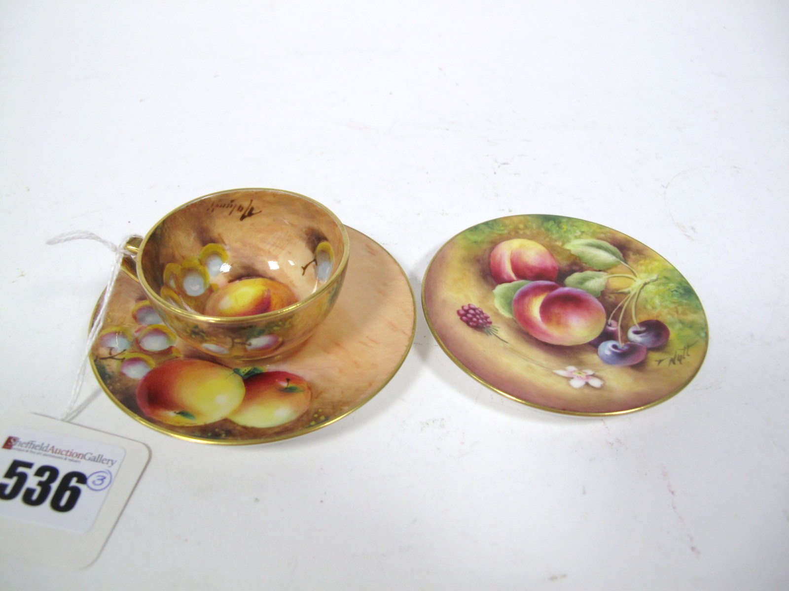 A Late XX Century Royal Worcester China Cabinet Cup and Saucer, printed and gilt with fruit on