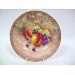 A Royal Worcester China Plate, painted and gilt with peaches and blackberries on a naturalistic