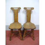 A Pair of Malcolm "Foxman" Pipes Joined Oak Chairs, with pierced top rail, adzed seats, on block and