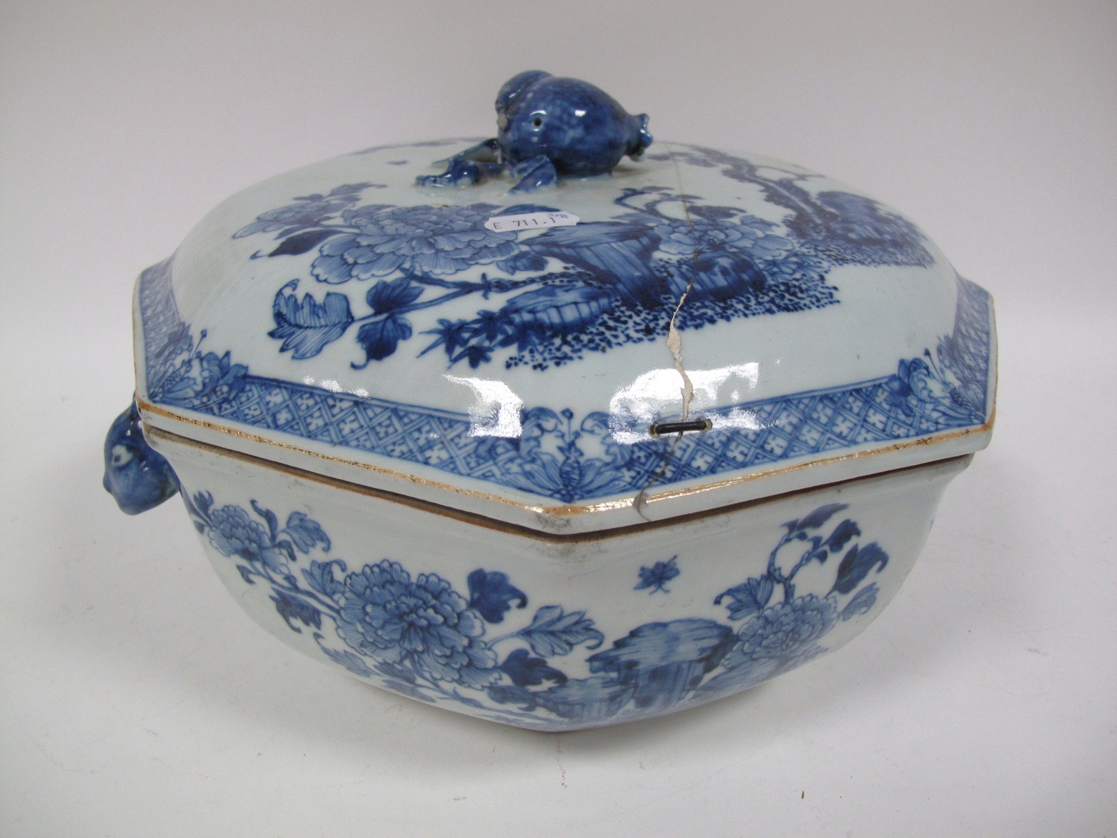 A Chinese Porcelain Octagonal Tureen and Cover, blue and white painted with garden scenes, the