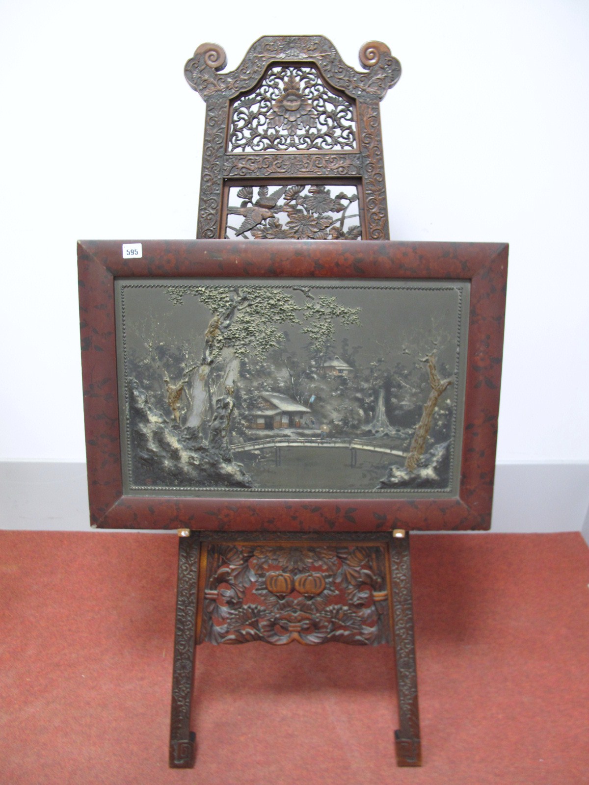 An Early XX Century Japanese Relief Plaster Moulded and Painted Panel, depicting a river landscape