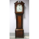 An XVIII Century Mahogany Eight-Day Longcase Clock, the hood with broken pediment, reeded pillars