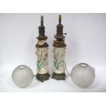A Pair of Late XIX Century Oil Lamps, the Japanese pottery cylindrical bases, relief moulded and