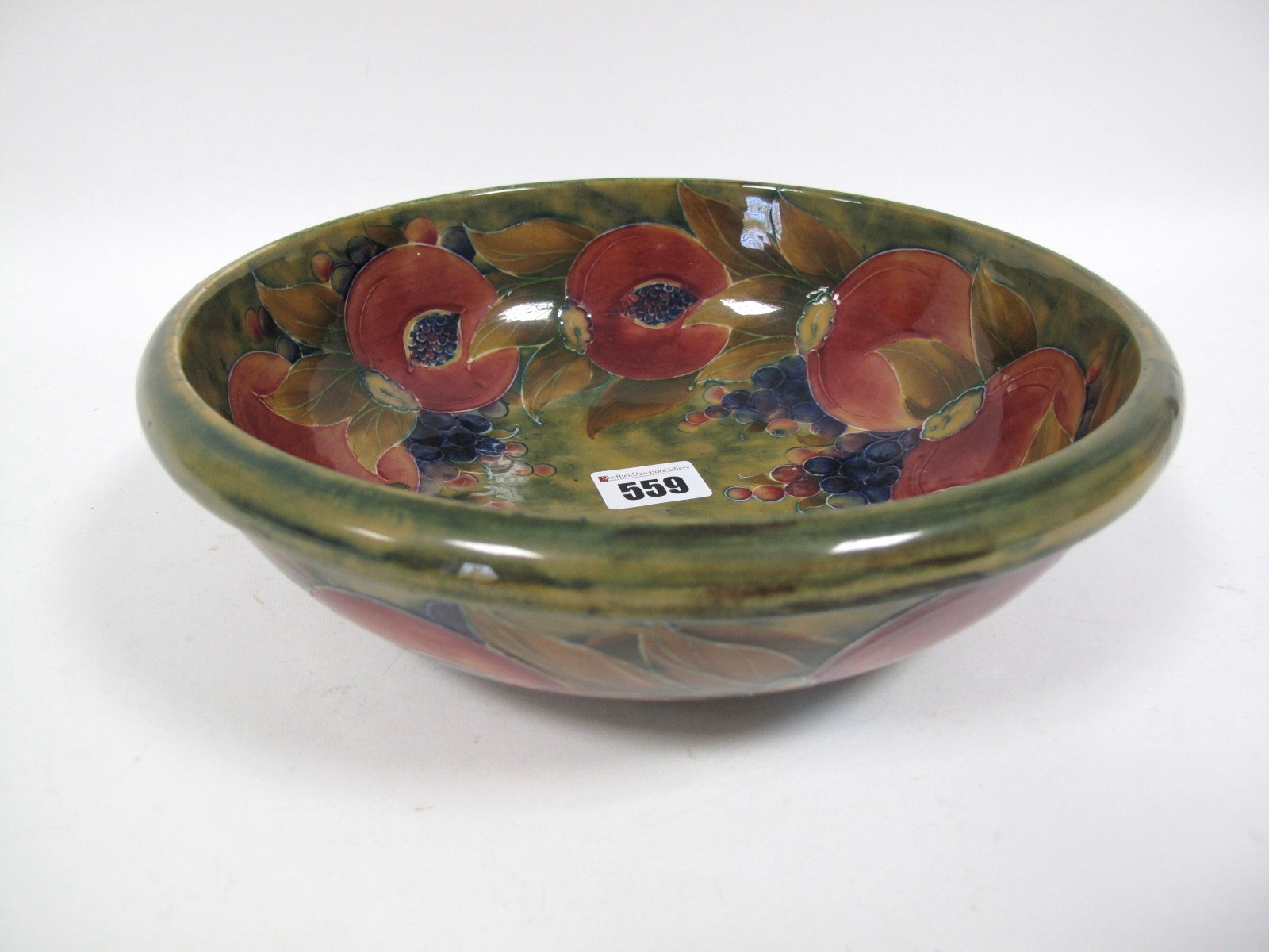 An Early XX Century Moorcroft Pottery Circular Bowl, tube-lined and painted with the Pomegranate