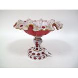 A XIX Century Ruby and White Overlaid Bohemian Glass Pedestal Dish, the ribbed and shaped top cut