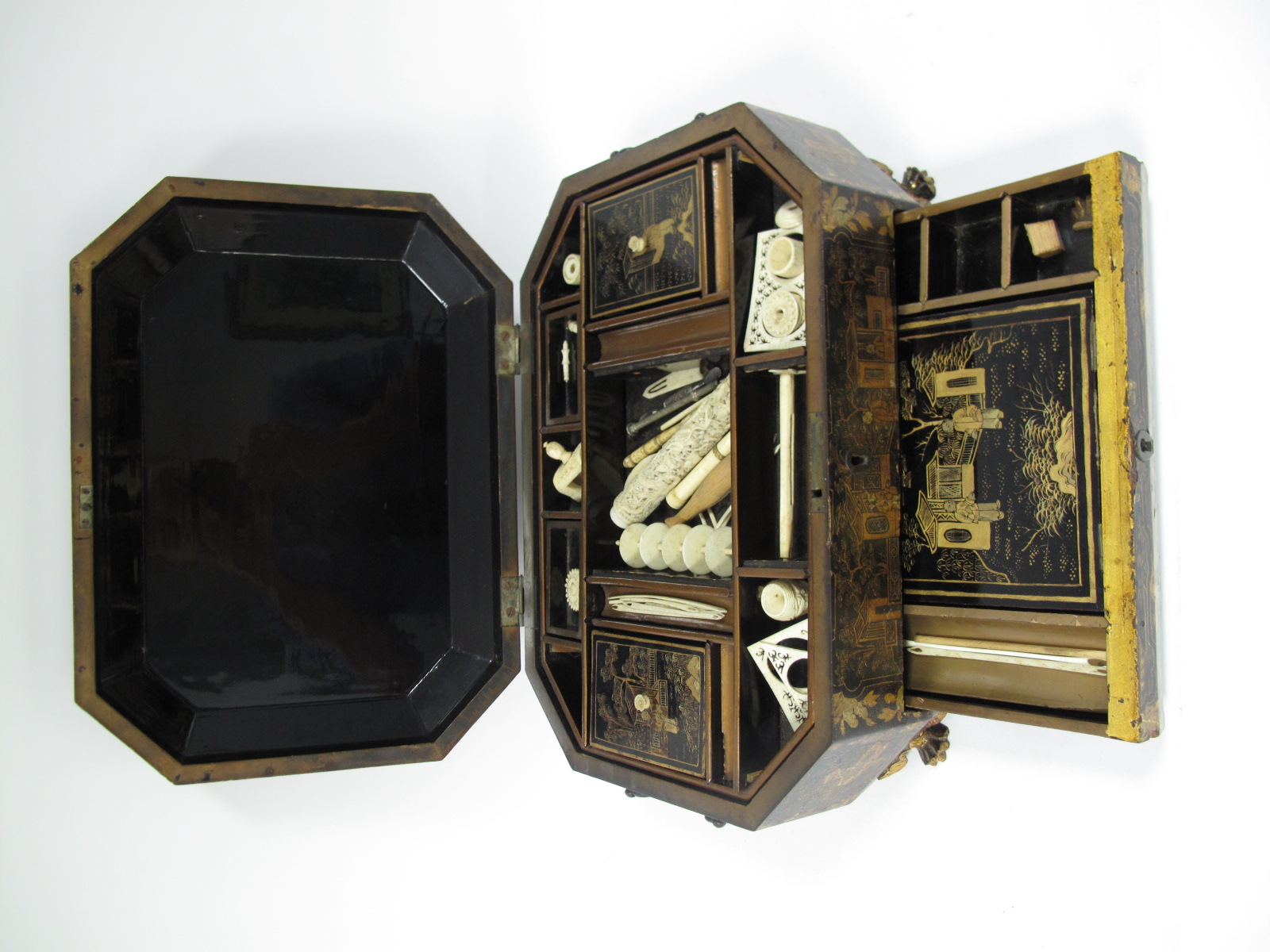 An Early XIX Century Chinese Black Lacquer Sewing Box, of canted rectangular form, painted and