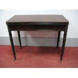 An Early XIX Century Mahogany Fold Over Tea Table, with rectangular top and reeded edge, on spiral