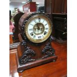 A Mid XIX Century Mantel Clock, the Ansonia movement striking on a coiled gong, the brass-framed