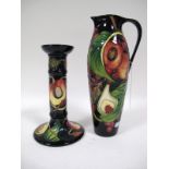 A Moorcroft Pottery Jug, of tall slender circular section, tube-lined and painted with fruit and