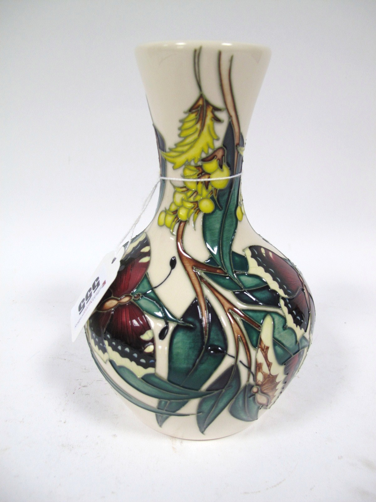 A Moorcroft Pottery Vase, tube-lined and painted with butterflies and flowering plants, impressed,