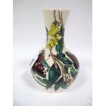 A Moorcroft Pottery Vase, tube-lined and painted with butterflies and flowering plants, impressed,