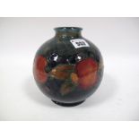 A Mid XX Century Moorcroft Pottery Vase, of globular form, tube-lined and painted with the