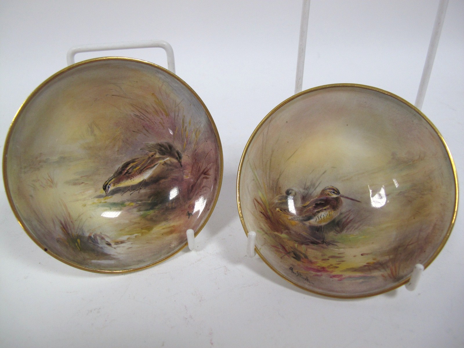 A Pair of Royal Worcester China Dishes, each of circular form with conforming raised foot,