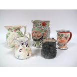 A Collection of XIX Century English Pottery Jugs, comprising a pearlware Bacchic example, 16cms