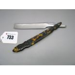 A c.1830 Cutthroat Razor, brass lined worked tortoiseshell fancy scales, 1/2" crocus polished blade,