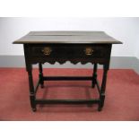 A Mid XVIII Century Oak Side Table, with rectangular top and single drawer, with shaped apron, on