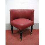 A William IV Corner Chair, in a red leatherette upholstery, on turned mahogany legs with brass