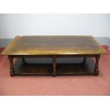 A Titchmarsh & Goodwin King Size Coffee Table, with moulded edge on swept turned and block