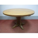 A Malcolm "Foxman" Pipes Oak Dining Table, the circular adzed top on quatrefoil pedestal base (