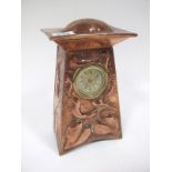 An Arts & Crafts Mantel Clock, the circular movement (defective), in a rectangular section case