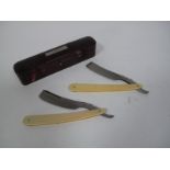 A c.1840-1850 Cased Pair of "Napoleon" Cutthroat Razors, shaped ivory scales, inset with shield