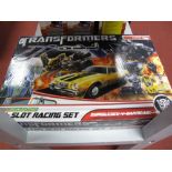 A Boxed Microscalextric (1:64th Scale) Transformers Slot Racing Set #G1080 Bumblebee V Barricade.