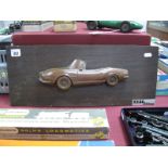 A Copper/Bronze Half Relief Model of a Fiat Dino, on a hanging wooden plaque, believed to have