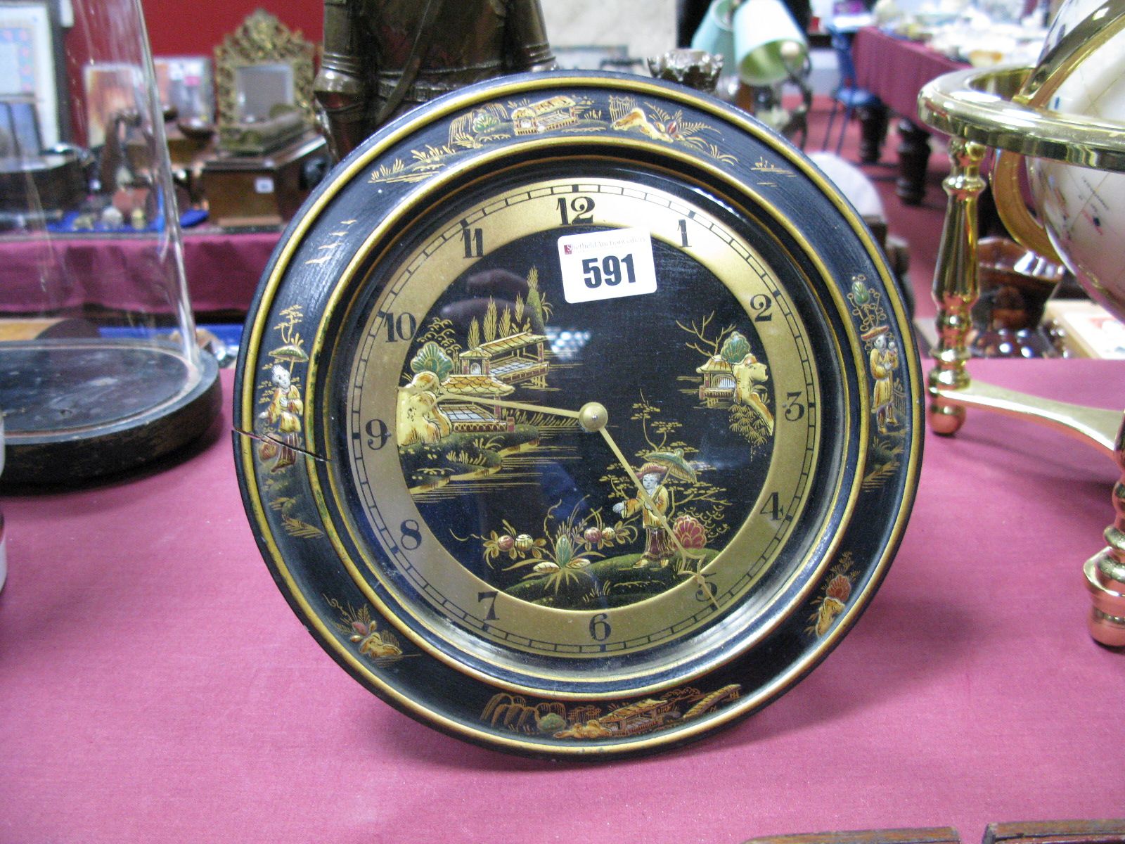 An Early XX Century Strut Mantel Clock, the French cylinder movement with circular black lacquered