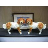 Pair of XIX Century Staffordshire Pottery Spaniel Dogs, (one with damage), 27cms tall. A Terry