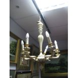 A French Style Painted Wooden Five Branch Ceiling Light, in cream with floral and gilt highlights.