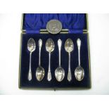 A Set of Six Hallmarked Silver Coffee Spoons, in fitted case and a 1797 cartwheel penny.