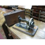 A Victorian Frister & Rossman Sewing Machine, with key.