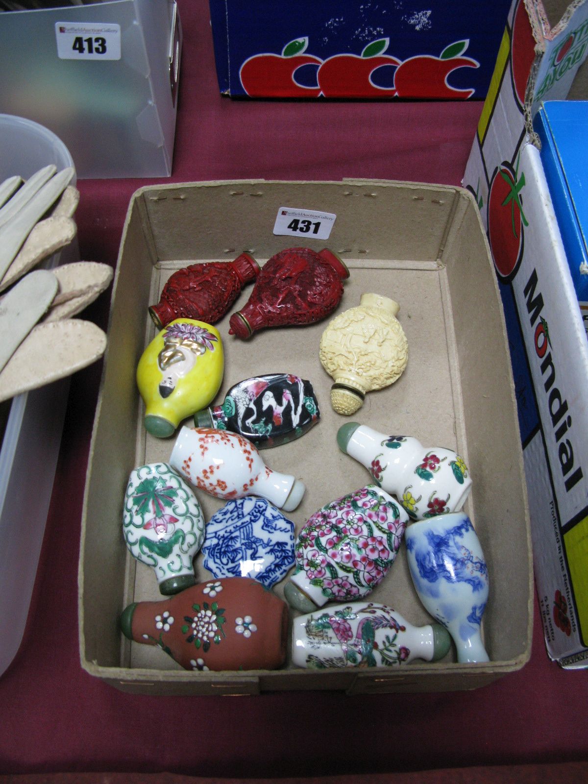 A Collection of Chinese Scent Bottles, decorated with figures and flowers.