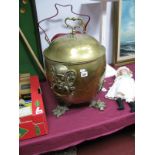 Brass Log Bucket, bearing twin mask ring handles to ovoid body on three paw feet, complete with