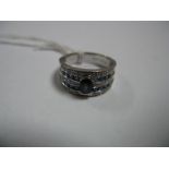 A Modern 9ct White Gold Sapphire and Diamond Set Wide Band, oval set to the centre between five