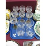 Stuart Glass - Seven Amber Stemmed Hock Glasses, and four rummers, all stamped:- One Tray