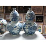 A Pair of Large Chinese Blue and White Pottery Double Gourd Vases, each featuring dragons and