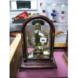 A "HERMLE" German XIX Century Style Mahogany Cased Skeleton Clock, in an arched case, gilded brass