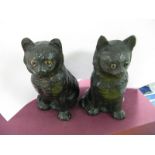 Two Bretby Pottery Black Cats, impressed 1349, 19cms high.