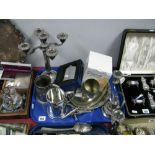 A Plated Candelabrum, twin branch candlestick, hip flask, mugs, model cannon, etc:- One Tray