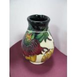 A Moorcroft Pottery Vase decorated with the "Anna Lily" design by Nicola Slaney, shape 7/3 9.5cms