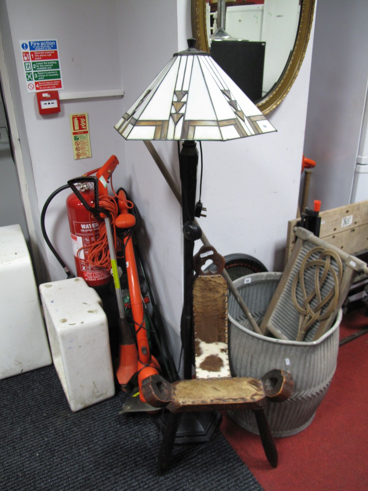 A Standard Lamp, with a Tiffany style light shade, together with an African three legged chair.