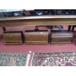 A Circa 1920's Oak Cased Singer Sewing Machine, a similar mahogany cased Singer, and a further oak