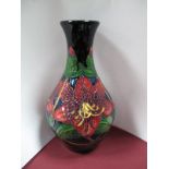 A Moorcroft Pottery Vase, decorated with the "Red Lily" (Trial) design, shape 372/8, factory marks