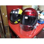 A Shoei and an Aprillia Motorcycle Helmet. (2)